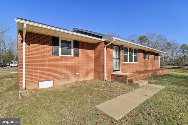 ranch-style house with a front yard