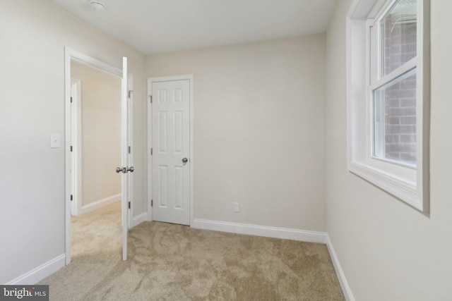 spare room with light colored carpet