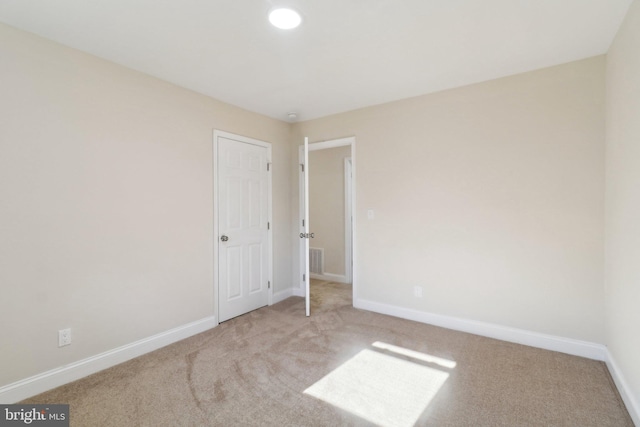 view of carpeted spare room