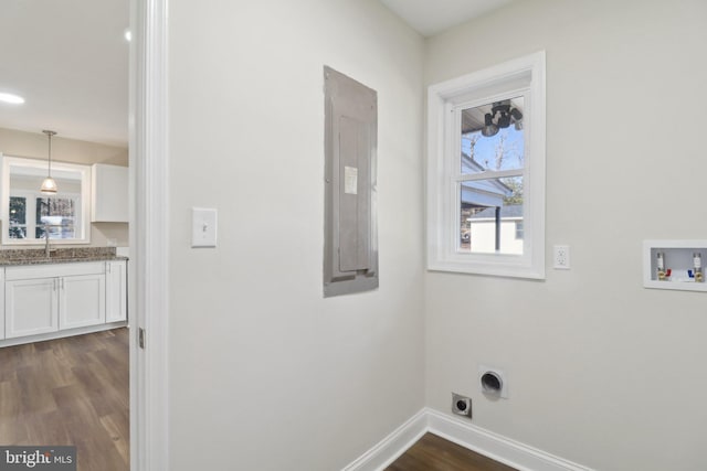 laundry area featuring sink, washer hookup, hookup for an electric dryer, dark hardwood / wood-style flooring, and electric panel