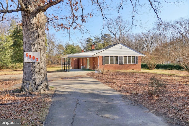 view of front of property with a carport