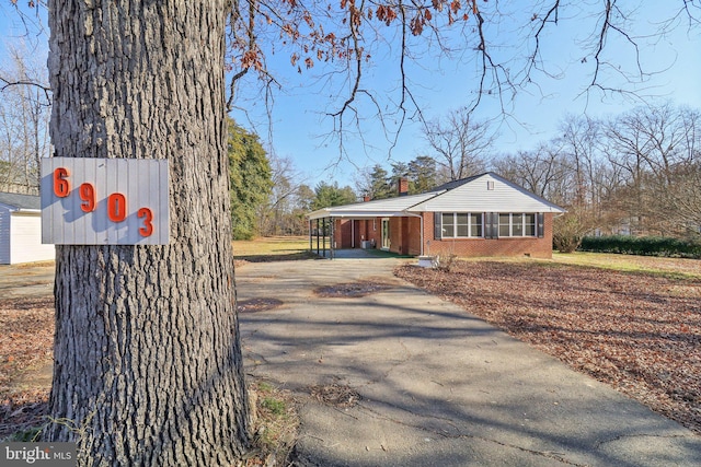 view of side of home featuring a carport