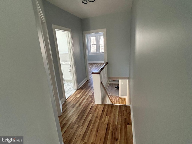 hall with light hardwood / wood-style flooring