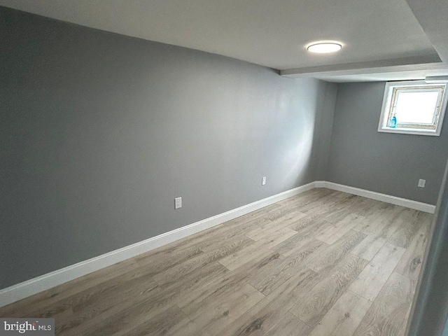 spare room featuring light wood-type flooring