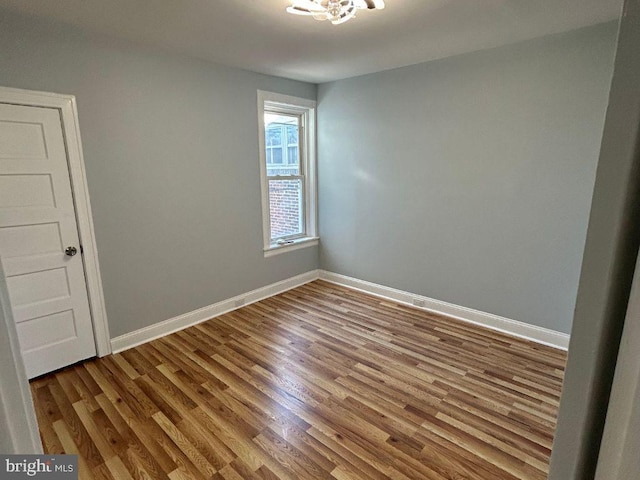 empty room featuring hardwood / wood-style flooring