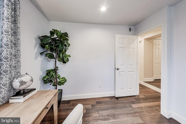 office with dark hardwood / wood-style floors