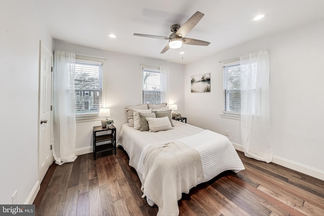 bedroom featuring ceiling fan and dark wood-type flooring