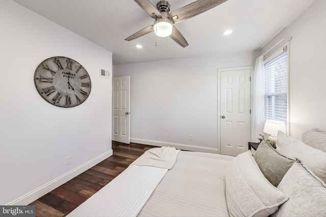 bedroom featuring ceiling fan and dark hardwood / wood-style floors