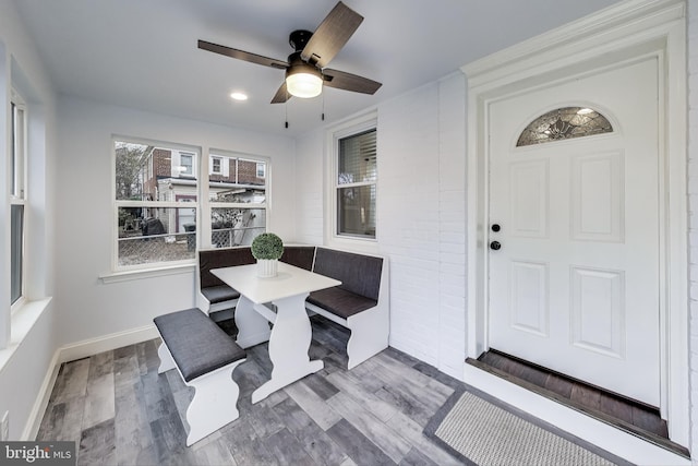 dining room with ceiling fan, breakfast area, and hardwood / wood-style floors