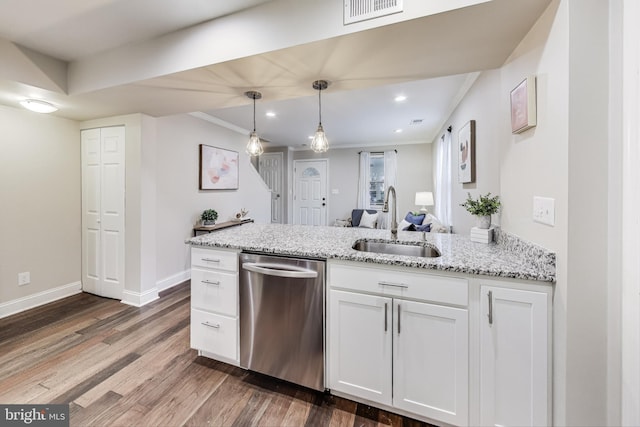 kitchen featuring dishwasher, light stone countertops, white cabinetry, and sink