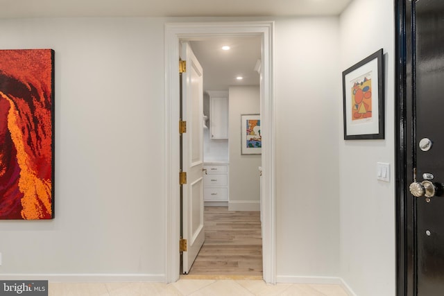 corridor with light tile patterned floors