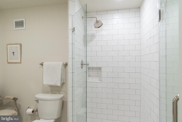 bathroom with toilet and walk in shower