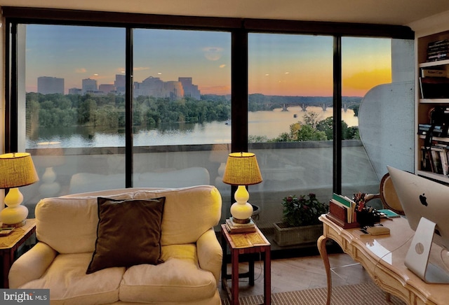 sunroom / solarium with a water view and a wealth of natural light