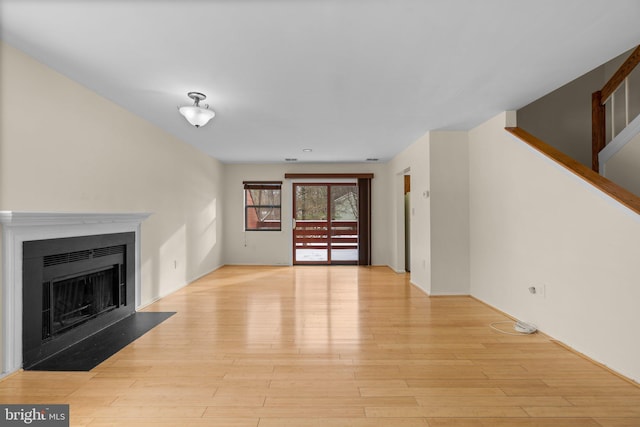 unfurnished living room with light hardwood / wood-style floors