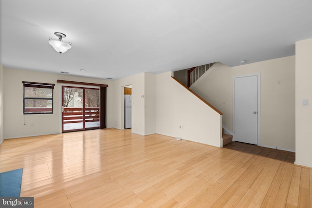 unfurnished room featuring light hardwood / wood-style floors