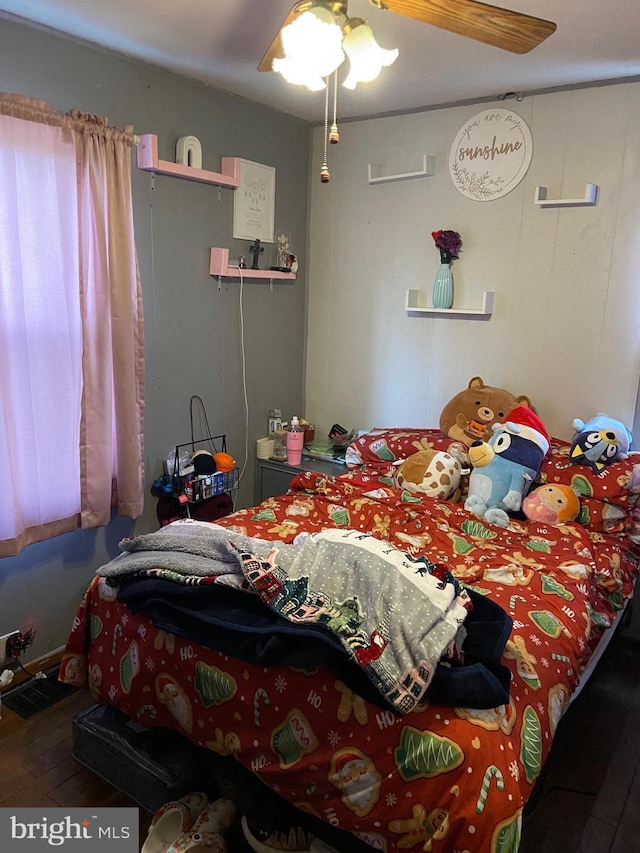 bedroom with hardwood / wood-style floors and ceiling fan