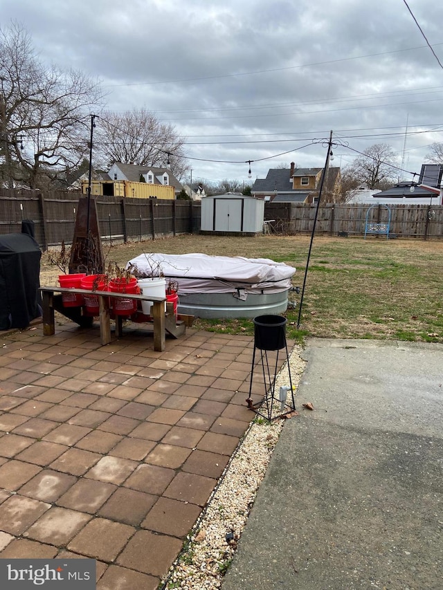 view of patio featuring a storage shed