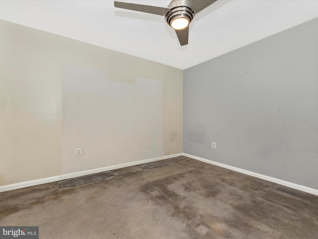 spare room with carpet floors and ceiling fan