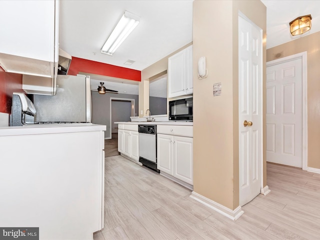 kitchen featuring white dishwasher, sink, white cabinetry, and light hardwood / wood-style floors