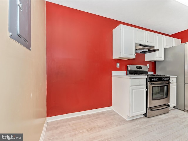 kitchen featuring gas stove, white cabinets, light wood-type flooring, and electric panel