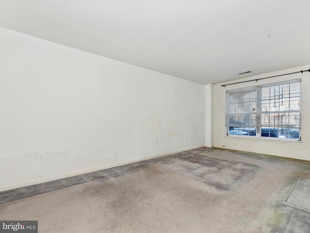 empty room featuring carpet floors