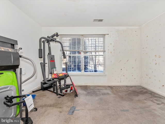 workout area featuring light colored carpet