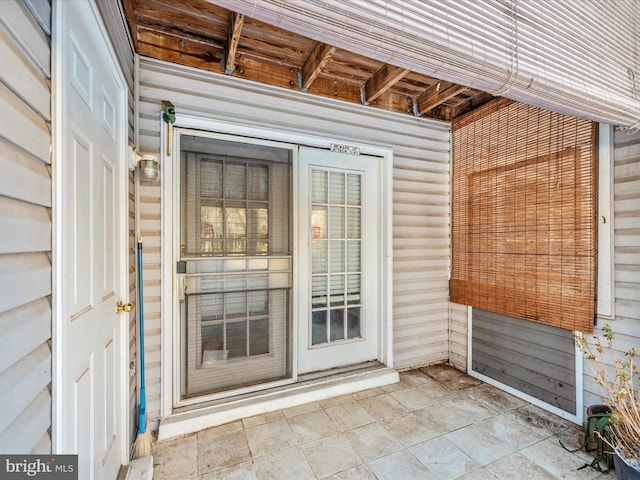 doorway to property with a patio