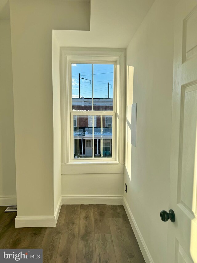 spare room with hardwood / wood-style floors