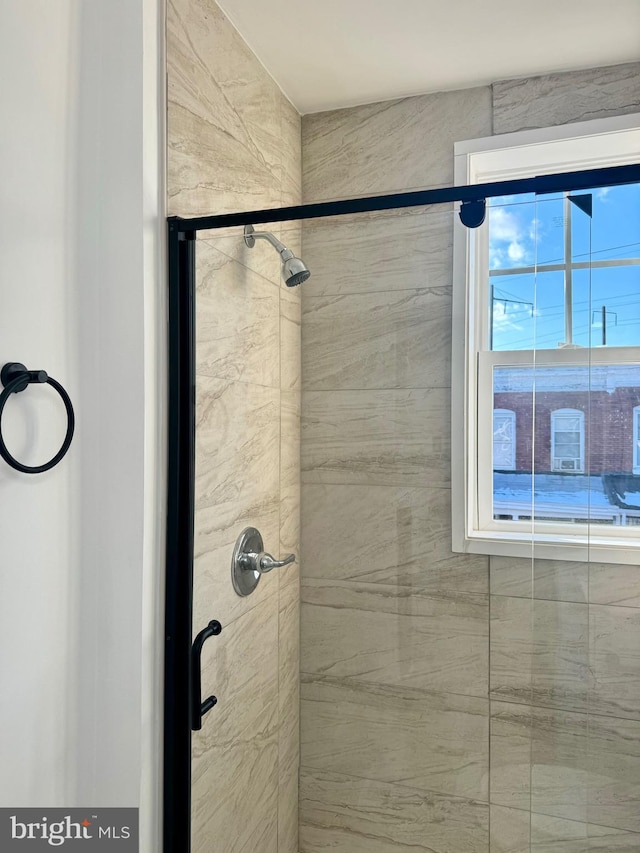 bathroom with a tile shower