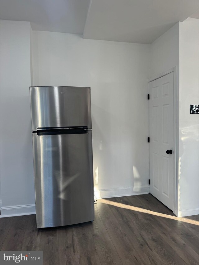 kitchen featuring dark hardwood / wood-style floors and stainless steel refrigerator