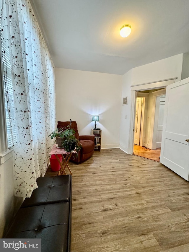 living area with light hardwood / wood-style flooring