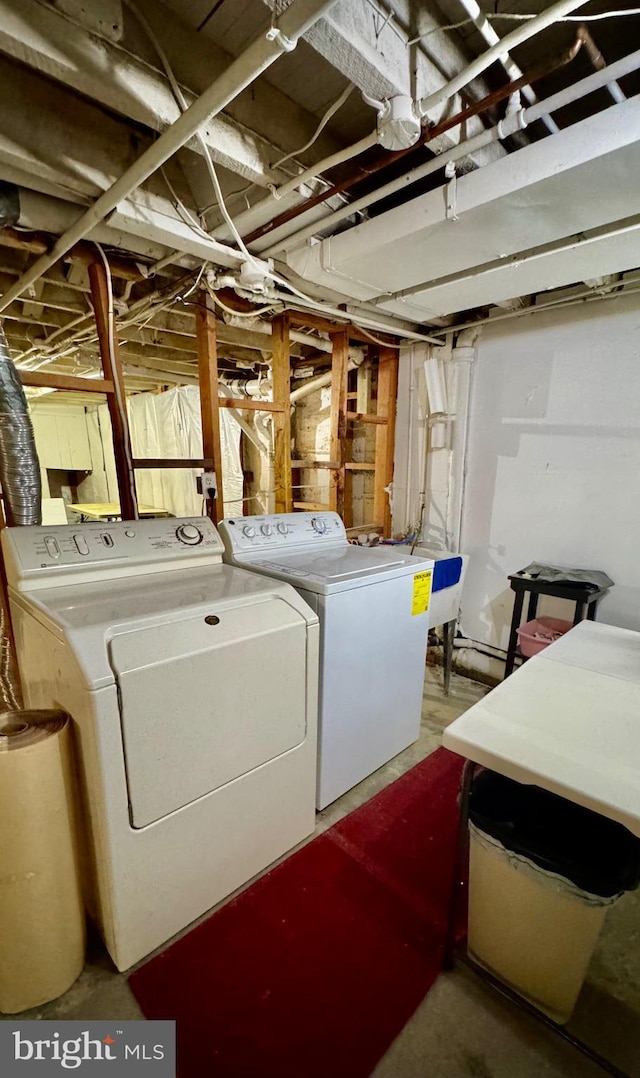 laundry area with washing machine and dryer