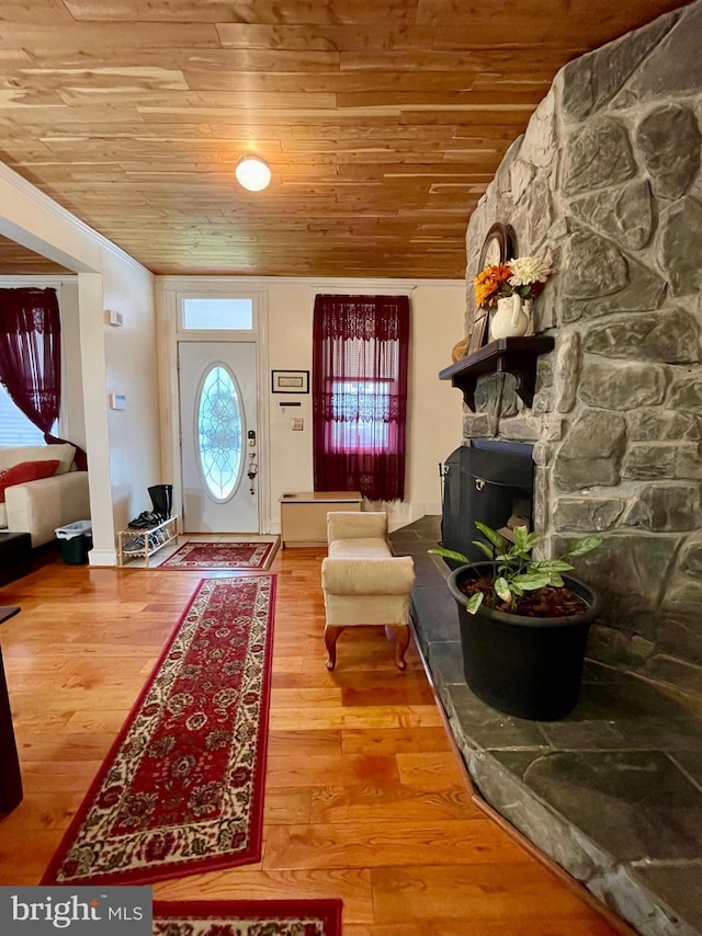 entrance foyer with hardwood / wood-style floors and wooden ceiling