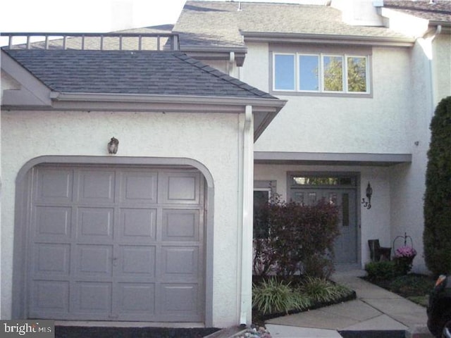 doorway to property featuring a garage