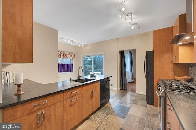 kitchen featuring black appliances, sink, dark stone countertops, and wall chimney range hood