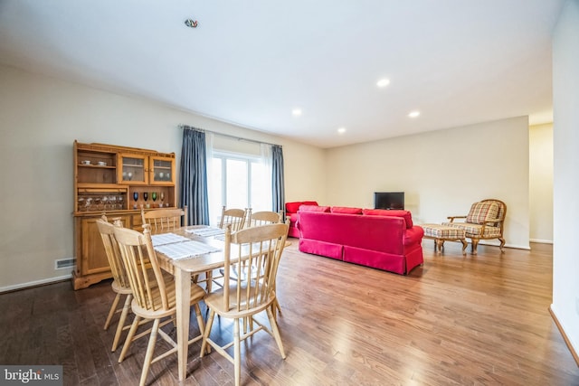 dining room with hardwood / wood-style floors