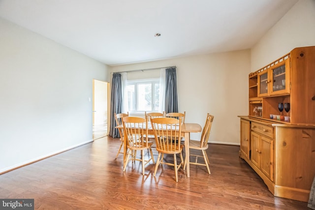 dining area with hardwood / wood-style floors