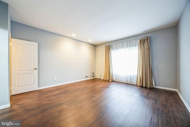 empty room featuring dark hardwood / wood-style floors