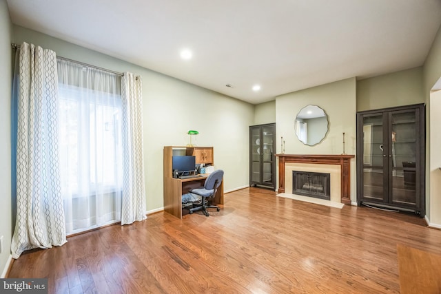 office space with hardwood / wood-style floors