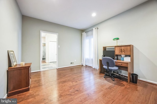 office with hardwood / wood-style floors