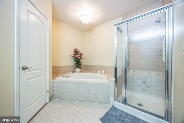 bathroom featuring tile patterned floors and plus walk in shower