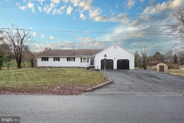 view of front of property with a front yard and a storage unit