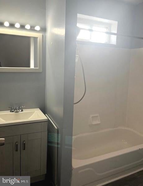 bathroom featuring vanity and shower / bathtub combination