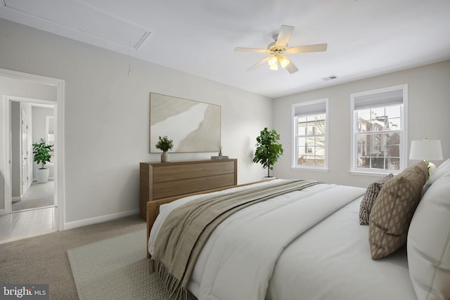 carpeted bedroom with ceiling fan