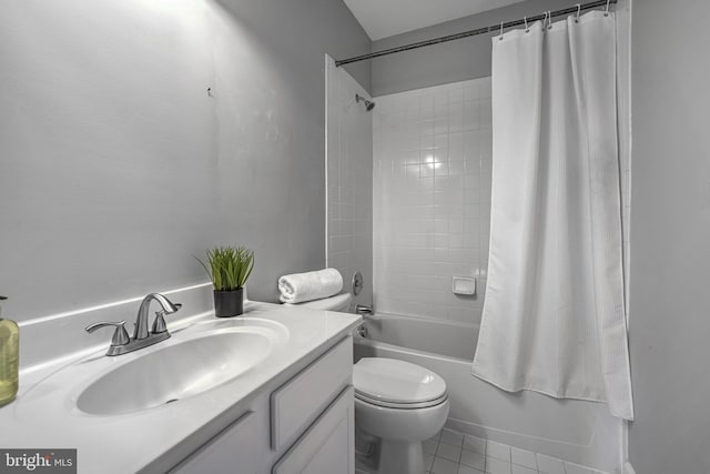 full bathroom with toilet, shower / tub combo, vanity, and tile patterned floors