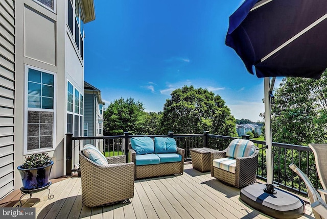 wooden terrace featuring an outdoor hangout area