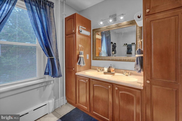 bathroom featuring a baseboard radiator, tile patterned floors, and vanity