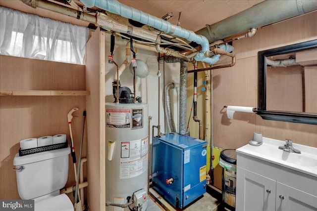 utility room featuring sink and water heater