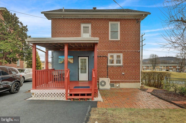 view of front of property with ac unit