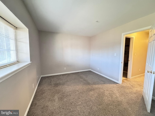 spare room featuring carpet floors
